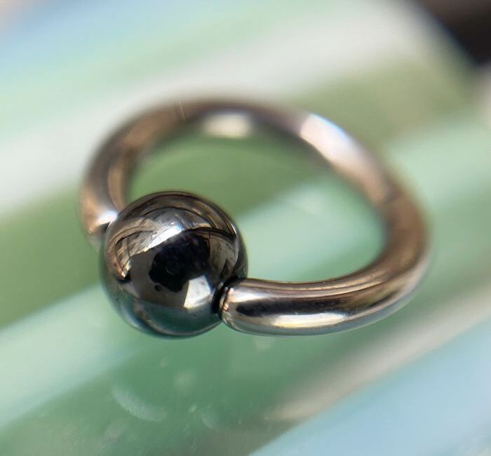 Argolla captive bola hematita Argolla captive bola hematita